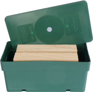Closed-up of a DIY termite monitors with 2 timbers inside a green box.